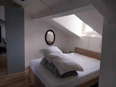 Un ou plusieurs lits dans un hébergement de l'établissement Cozy studio Clichy Levallois