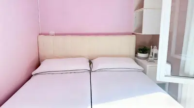 Un ou plusieurs lits dans un hébergement de l'établissement Pink Warm Studio near Arc de Triomphe