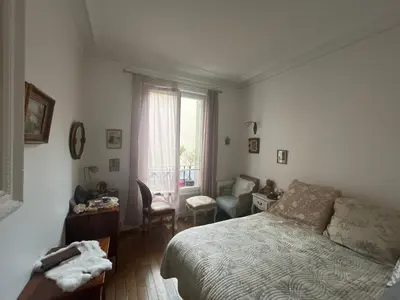 Un ou plusieurs lits dans un hébergement de l'établissement Belle chambre à Montmartre