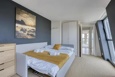 Un ou plusieurs lits dans un hébergement de l'établissement Luxury Penthouse with A/C Terrace & View-Le Marais