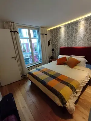 Un ou plusieurs lits dans un hébergement de l'établissement Sacré coeur studio