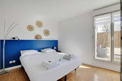 Un ou plusieurs lits dans un hébergement de l'établissement Cosy apartment & balcony -1BR 4P- Levallois-Perret