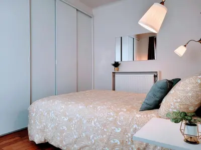 Un ou plusieurs lits dans un hébergement de l'établissement Cosy Case proche Paris Montmartre
