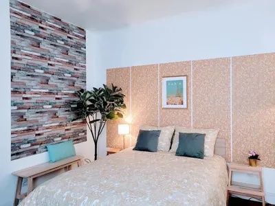 Un ou plusieurs lits dans un hébergement de l'établissement Cosy Case proche Paris Montmartre
