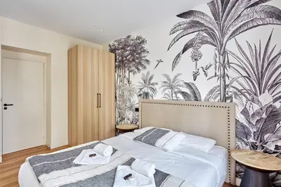 Un ou plusieurs lits dans un hébergement de l'établissement Apartment Invalide by Studio prestige