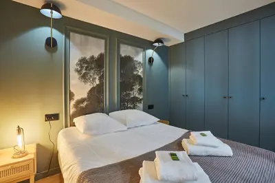 Un ou plusieurs lits dans un hébergement de l'établissement Residense Montmartre by Studio prestige