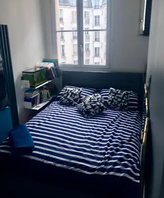 Un ou plusieurs lits dans un hébergement de l'établissement Bel appartement à Paris