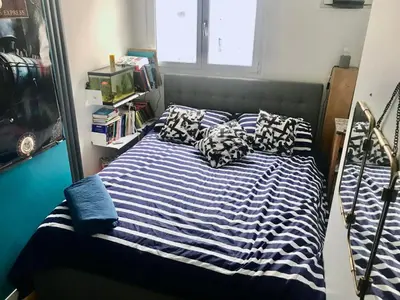 Un ou plusieurs lits dans un hébergement de l'établissement Bel appartement à Paris