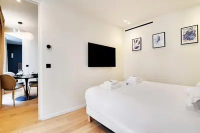 Télévision ou salle de divertissement dans l'établissement Elegant apartment - 2BR 6P - Opéra