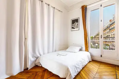 Un ou plusieurs lits dans un hébergement de l'établissement GuestReady - Appartement Parisien dans le 10ème