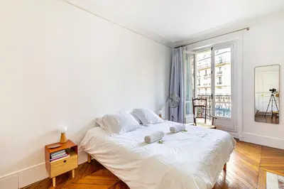 Un ou plusieurs lits dans un hébergement de l'établissement GuestReady - Appartement Parisien dans le 10ème