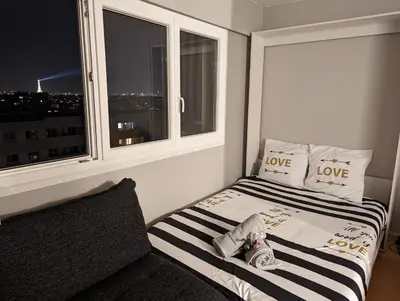 Un ou plusieurs lits dans un hébergement de l'établissement Charming Studio with Eiffel View