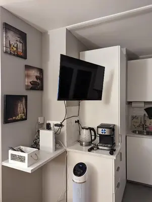 Cuisine ou kitchenette dans l'établissement Charming Studio with Eiffel View