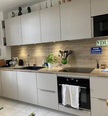 Cuisine ou kitchenette dans l'établissement Bel Appartement avec balcon proche Roland Garos et Parc des Princes