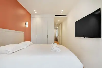 Un ou plusieurs lits dans un hébergement de l'établissement Chic apartment - 2BR-6P - Opera House