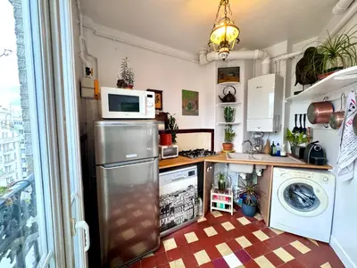 Cuisine ou kitchenette dans l'établissement Paris 2 bedrooms chic apartment 18th district