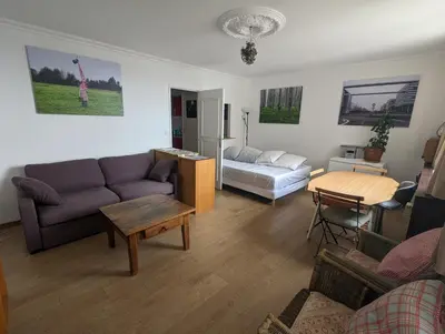 Coin salon dans l'établissement Large studio with terrace for up to 4 people