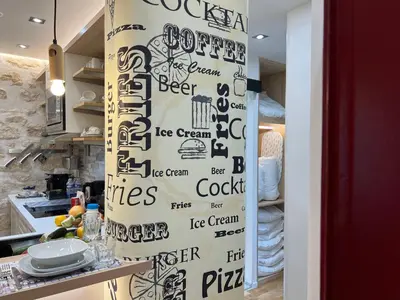 Cuisine ou kitchenette dans l'établissement Cosy appartement à 500m de Montmartre