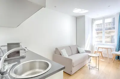 Coin salon dans l'établissement Ciseaux 4F - Studio in Saint Germain des Prés