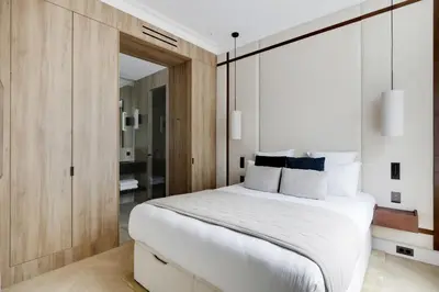 Un ou plusieurs lits dans un hébergement de l'établissement TheLander - Serviced Apartments in Louvre - Rivoli