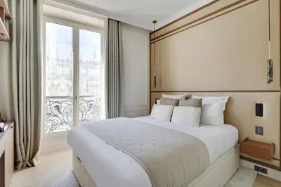 Un ou plusieurs lits dans un hébergement de l'établissement TheLander - Serviced Apartments in Louvre - Rivoli