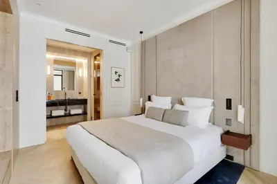 Un ou plusieurs lits dans un hébergement de l'établissement TheLander - Serviced Apartments in Louvre - Rivoli