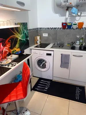 Cuisine ou kitchenette dans l'établissement Paris Sud-porte de Gentilly mignon T2 250 m de Paris