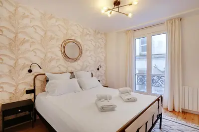 Un ou plusieurs lits dans un hébergement de l'établissement Pick A Flat's Apartment in Montmartre - Rue Drevet