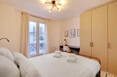 Un ou plusieurs lits dans un hébergement de l'établissement Pick A Flat's Apartment in Montmartre - Rue Drevet
