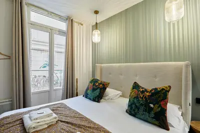 Un ou plusieurs lits dans un hébergement de l'établissement Apartment Montmartre by Studio prestige