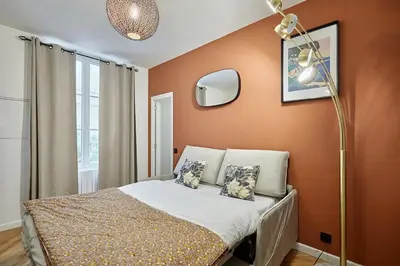 Un ou plusieurs lits dans un hébergement de l'établissement Apartment Montmartre by Studio prestige