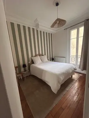 Un ou plusieurs lits dans un hébergement de l'établissement Logement Paris Centre - Amazing Flat Saint Martin