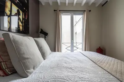 Un ou plusieurs lits dans un hébergement de l'établissement Stay In a prime location Paris