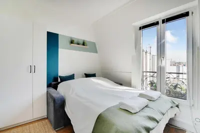Un ou plusieurs lits dans un hébergement de l'établissement Ideal studio for 2 people - Marché des Batignolles