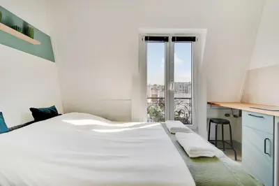 Un ou plusieurs lits dans un hébergement de l'établissement Ideal studio for 2 people - Marché des Batignolles