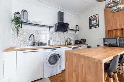 Cuisine ou kitchenette dans l'établissement Appartement 2 étages Paris - Métro 9 Grands Boulevards - Folies Bergères