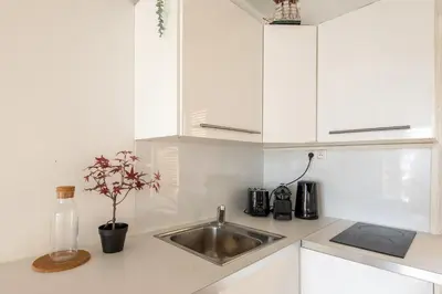 Cuisine ou kitchenette dans l'établissement Géranimus 36A : Heart of Paris