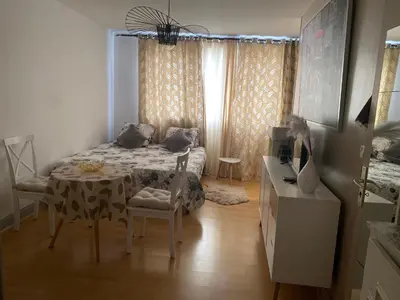 Un ou plusieurs lits dans un hébergement de l'établissement Cosy studio Paris Wagram