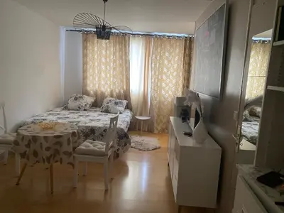 Un ou plusieurs lits dans un hébergement de l'établissement Cosy studio Paris Wagram