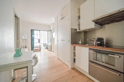 Cuisine ou kitchenette dans l'établissement Warm & Welcoming Flat - Family's Ideal - Marais