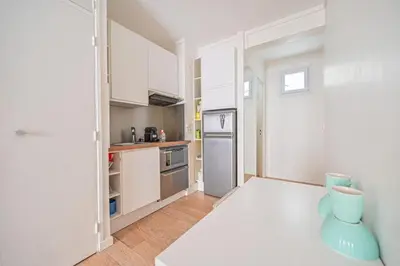 Cuisine ou kitchenette dans l'établissement Warm & Welcoming Flat - Family's Ideal - Marais