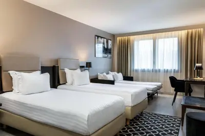 Un ou plusieurs lits dans un hébergement de l'établissement AC Hotel Paris Porte Maillot by Marriott