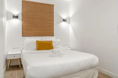 Un ou plusieurs lits dans un hébergement de l'établissement Appartement spacieux et lumineux à Montorgueil