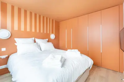 Un ou plusieurs lits dans un hébergement de l'établissement Rome Batignolles - Luxe Charme - 2P