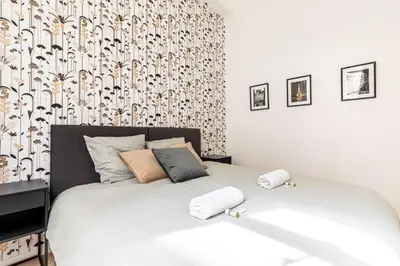 Un ou plusieurs lits dans un hébergement de l'établissement GuestReady - Bel Appartement Le Marais