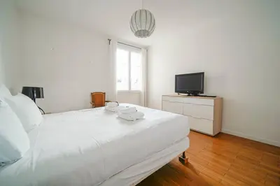 Un ou plusieurs lits dans un hébergement de l'établissement Appartement familiale #Wagram #Pereire - II
