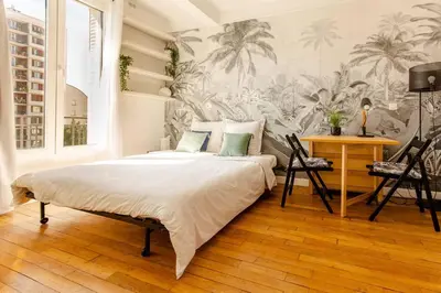 Un ou plusieurs lits dans un hébergement de l'établissement Cozy studio near Montmartre