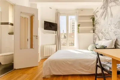 Un ou plusieurs lits dans un hébergement de l'établissement Cozy studio near Montmartre