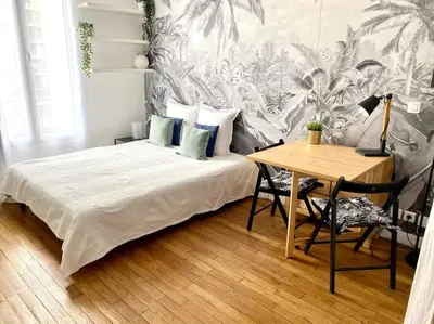 Un ou plusieurs lits dans un hébergement de l'établissement Cozy studio near Montmartre
