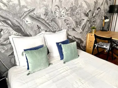 Un ou plusieurs lits dans un hébergement de l'établissement Cozy studio near Montmartre